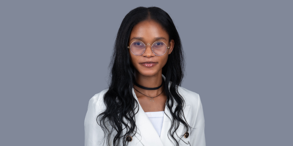 Precious Kolawole wearing a white jacket