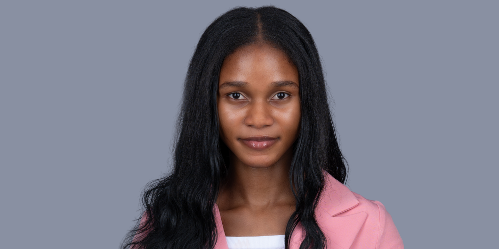 Precious Kolawole wearing a pink jacket